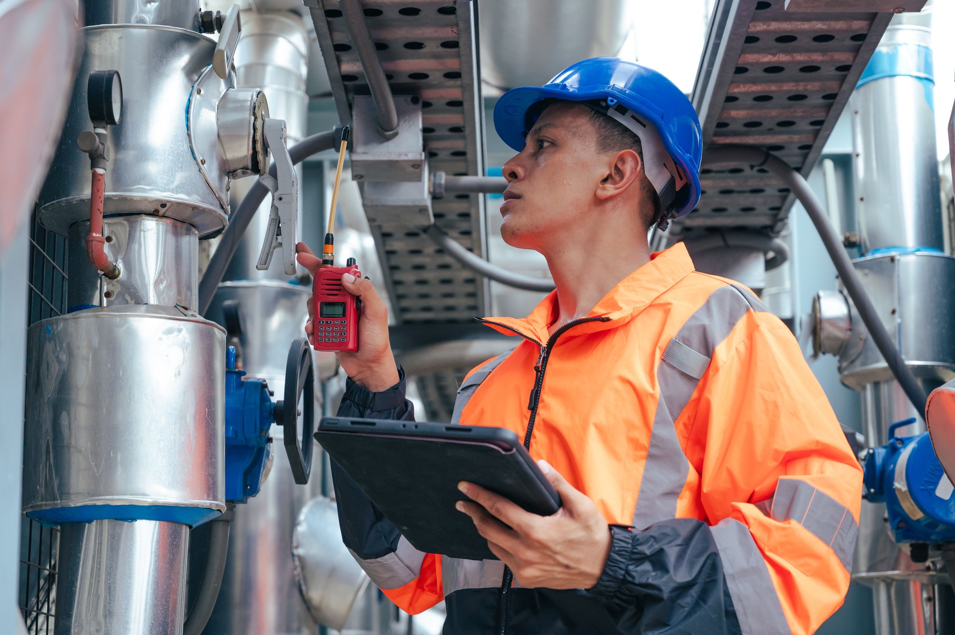 The technician carefully inspecting a section of pipeline during a construction project, emphasizing safety and precision in infrastructure development.