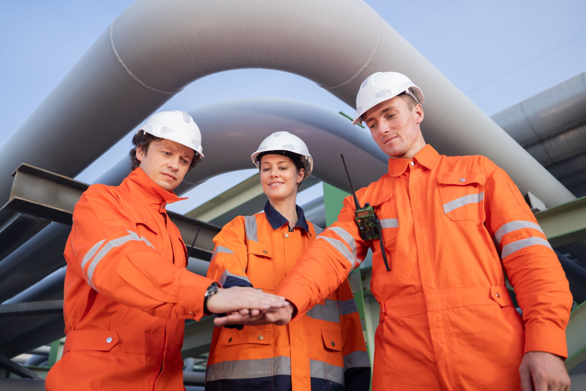 Oil refinery engineer Joint Hands Showing Their Teamwork